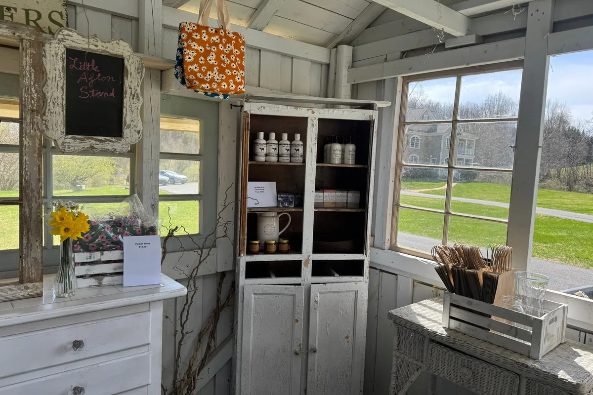 Inside the flower house: the Little Afton Stand chalkboard and a cabinet of local soaps and lotions
